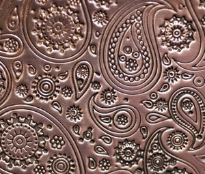 paisley pattern textured sheet metal in copper