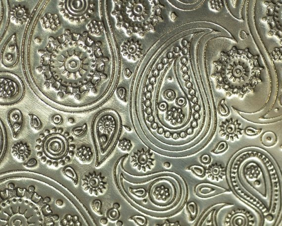 paisley pattern textured sheet metal in brass